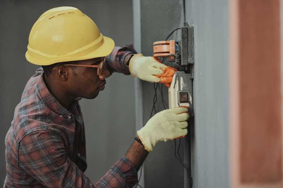 Professional security technician installing home security equipment